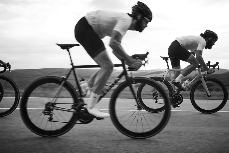 Club riders at speed in matching MVMNT custom kit